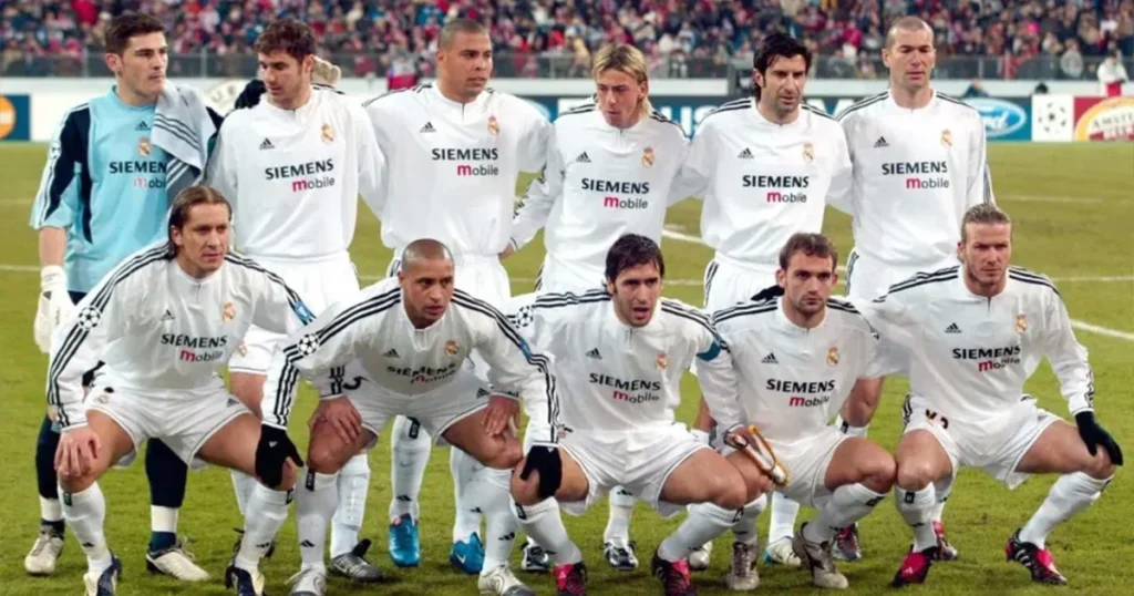 A group of men in white soccer uniforms stands on a field, showcasing camaraderie and teamwork for Funny Soccer Team Names.