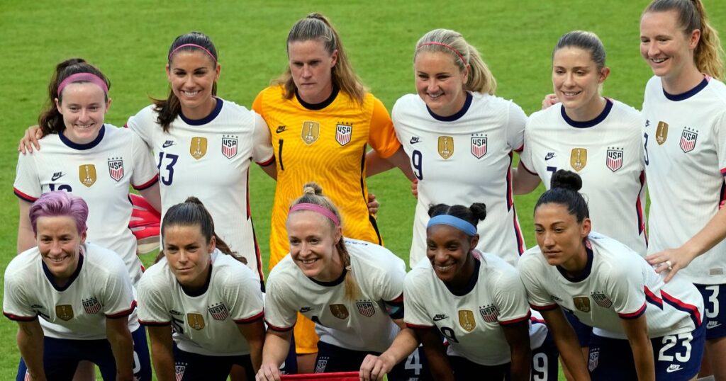 The US Women's National Team poses for a team photo, showcasing unity and strength in their Girls Soccer Team Names.