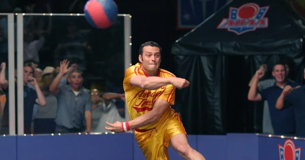 A man in yellow shorts prepares to throw a ball, showcasing the excitement of the Best Dodgeball game.